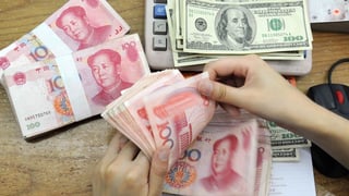 China-Yuan-weakens-against-USD